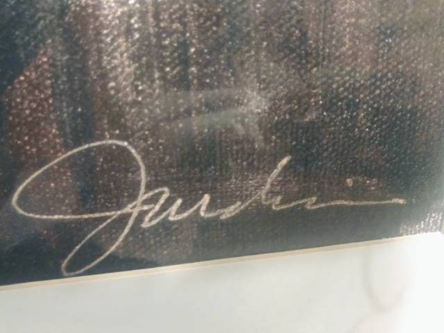 Framed art piece under glass
